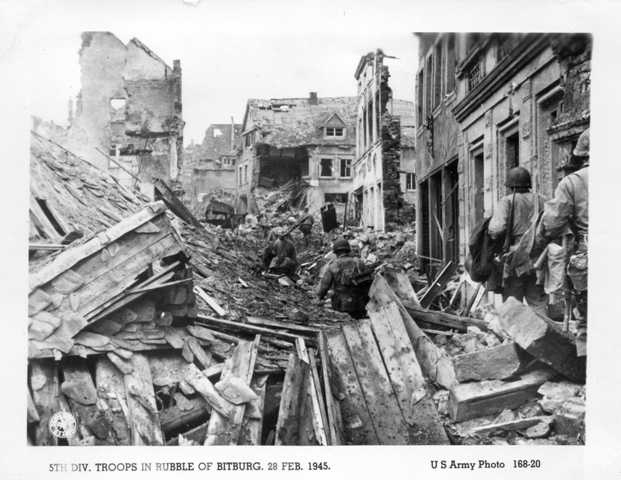 5th Div. troops in rubble of Bitburg. 28 Feb. 1945